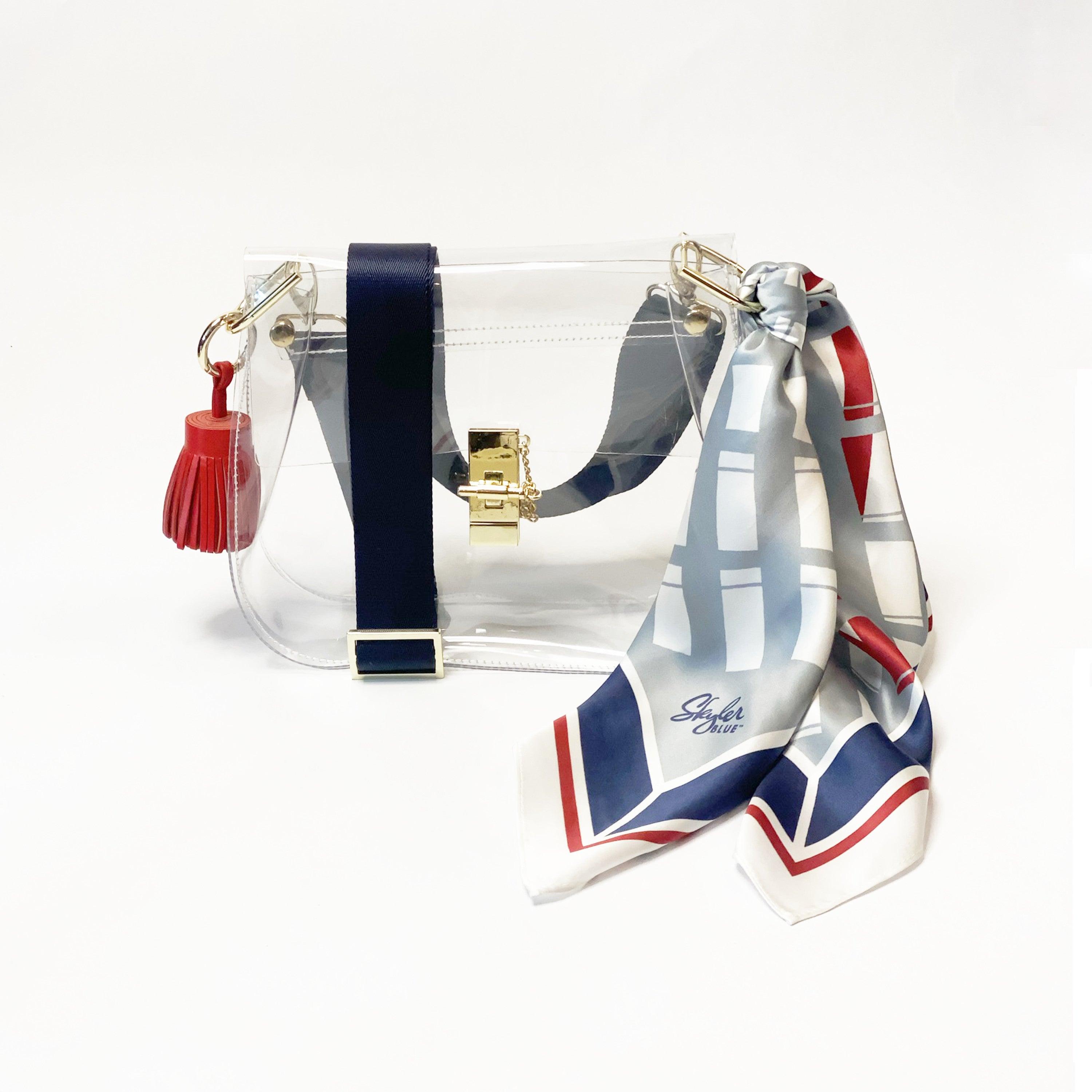 Skyler Blue’s The Dome - Go Texan Day Medium Saddle Clear Bag stadium approved clear bag / clear purse including adjustable, nylon webbing shoulder or crossbody strap with herringbone weave and gold hardware, 60-centimeter 100% silk twill scarf, and 100% genuine leather tassel.