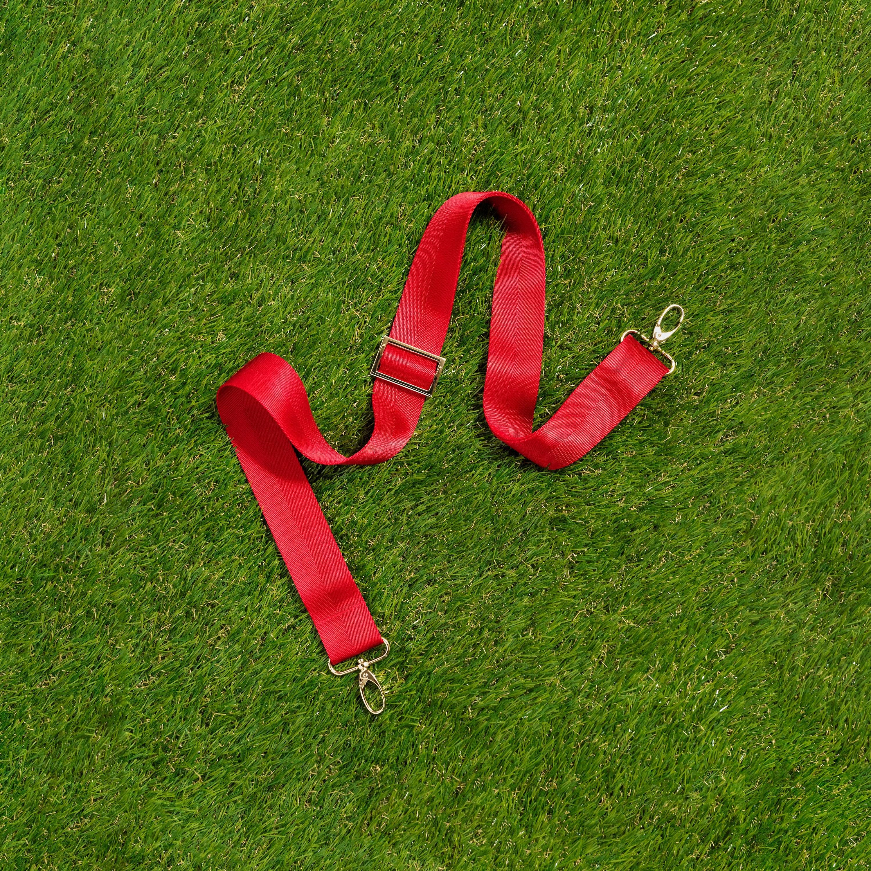 Skyler Blue’s adjustable, nylon webbing scarlet red fanny pack strap with herringbone weave and gold hardware.