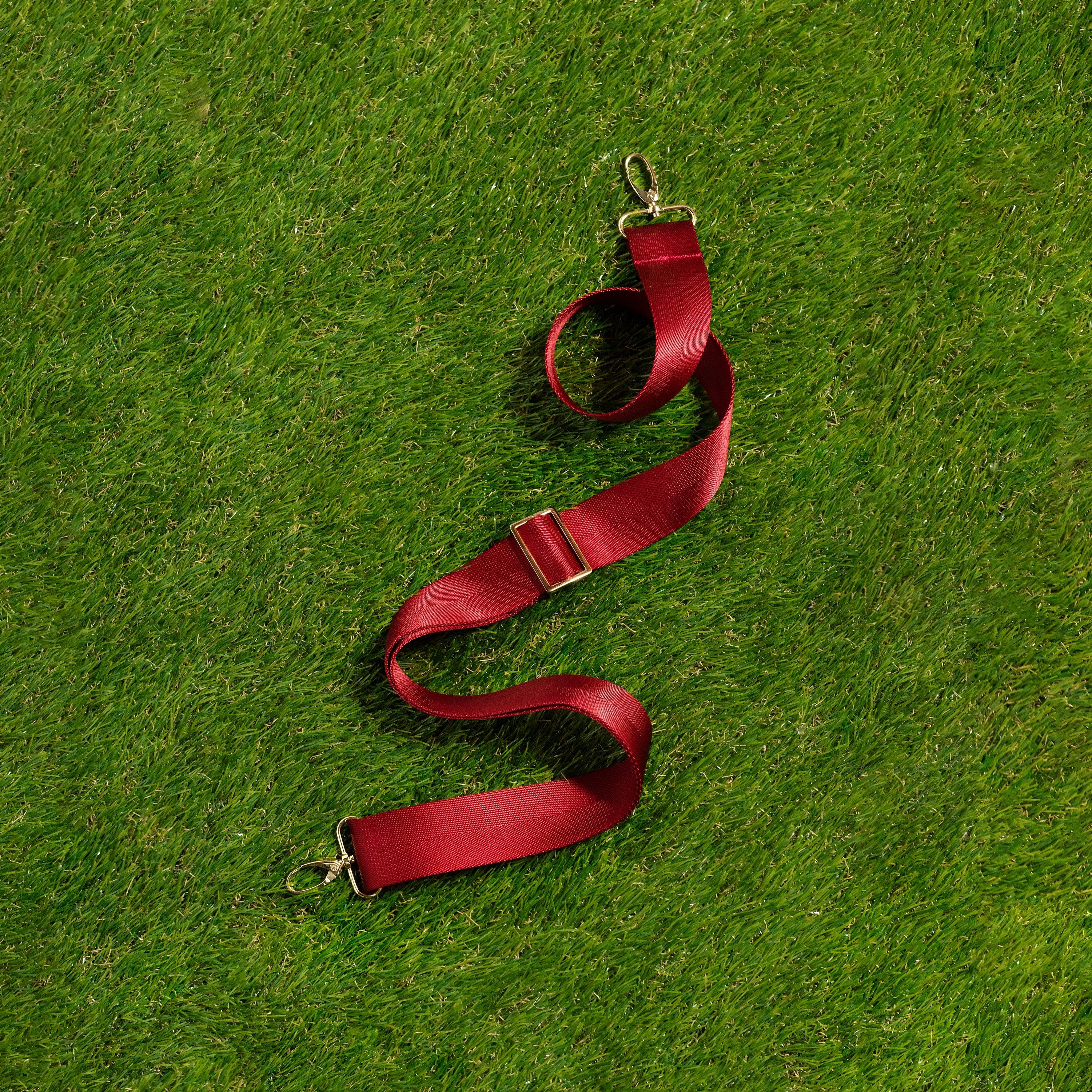 Skyler Blue’s adjustable, nylon webbing cardinal red shoulder or crossbody strap with herringbone weave and gold hardware.