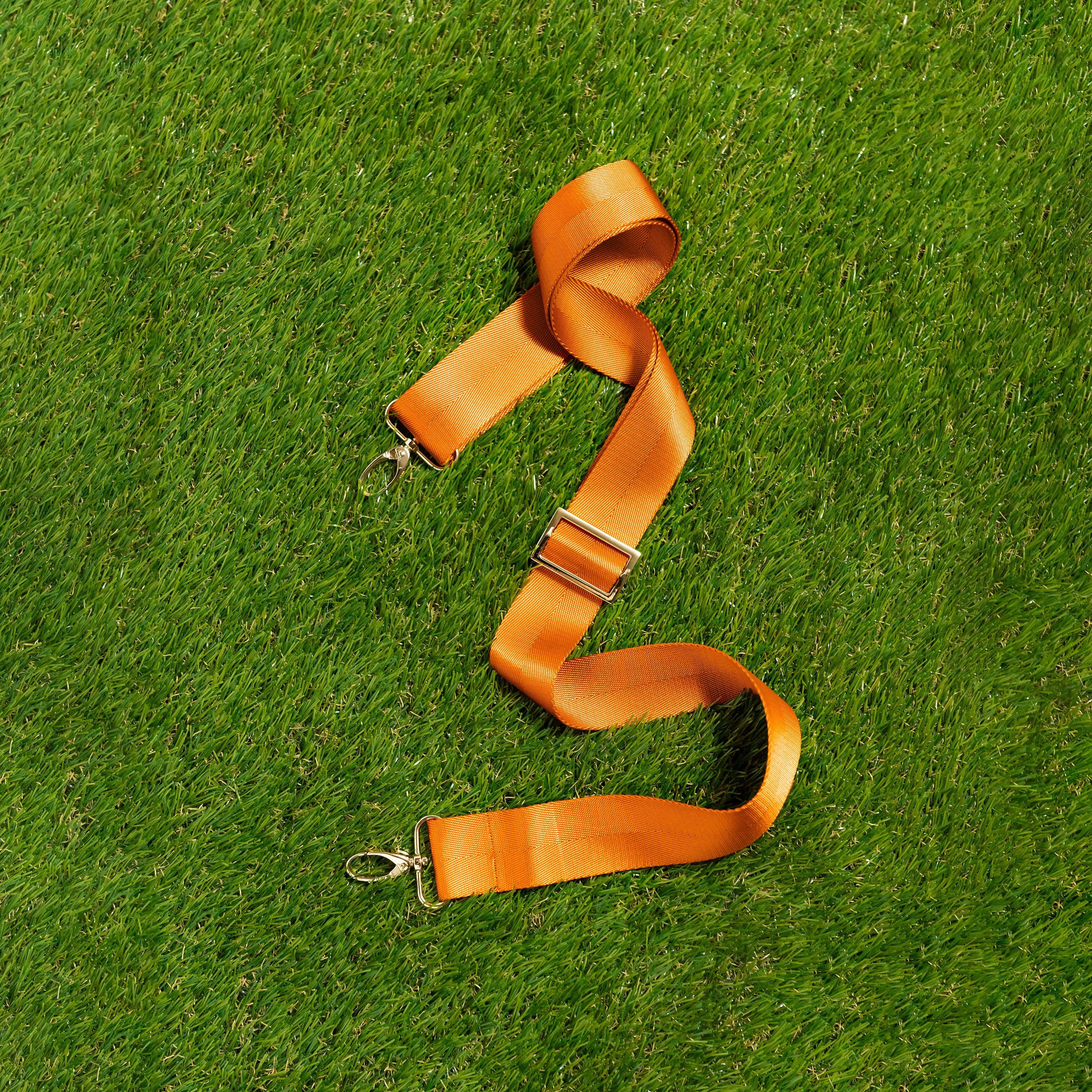 Skyler Blue’s adjustable, nylon webbing knox orange shoulder or crossbody strap with herringbone weave and gold hardware.