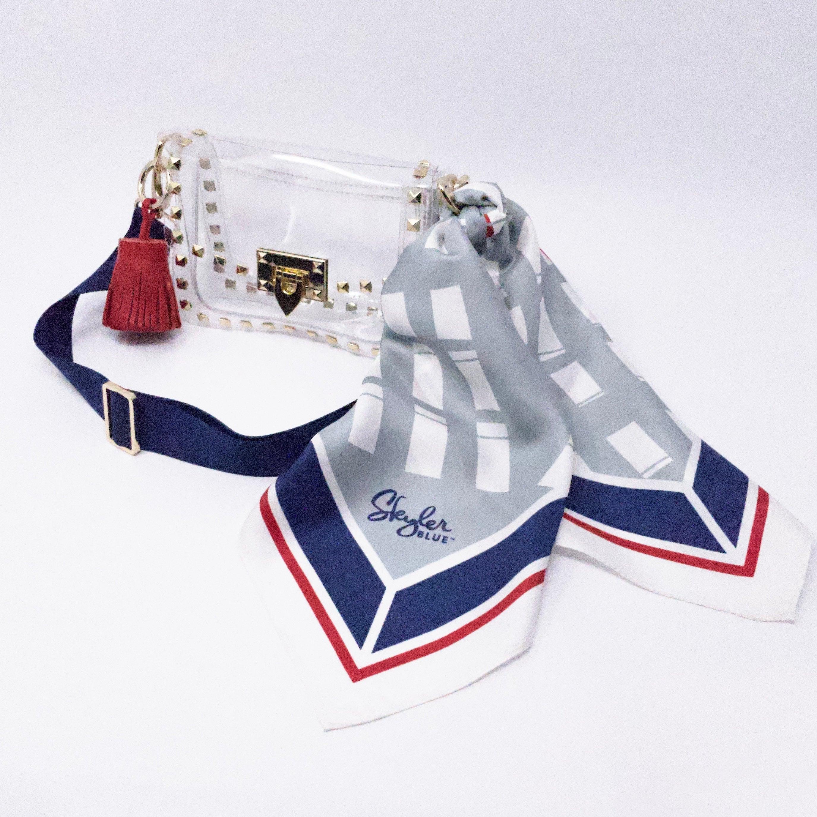 Skyler Blue’s The Dome - Go Texan Day Small Studded Clear Bag stadium approved clear bag / clear purse including adjustable, nylon webbing shoulder or crossbody strap with herringbone weave and gold hardware, 60-centimeter 100% silk twill scarf, and 100% genuine leather tassel.