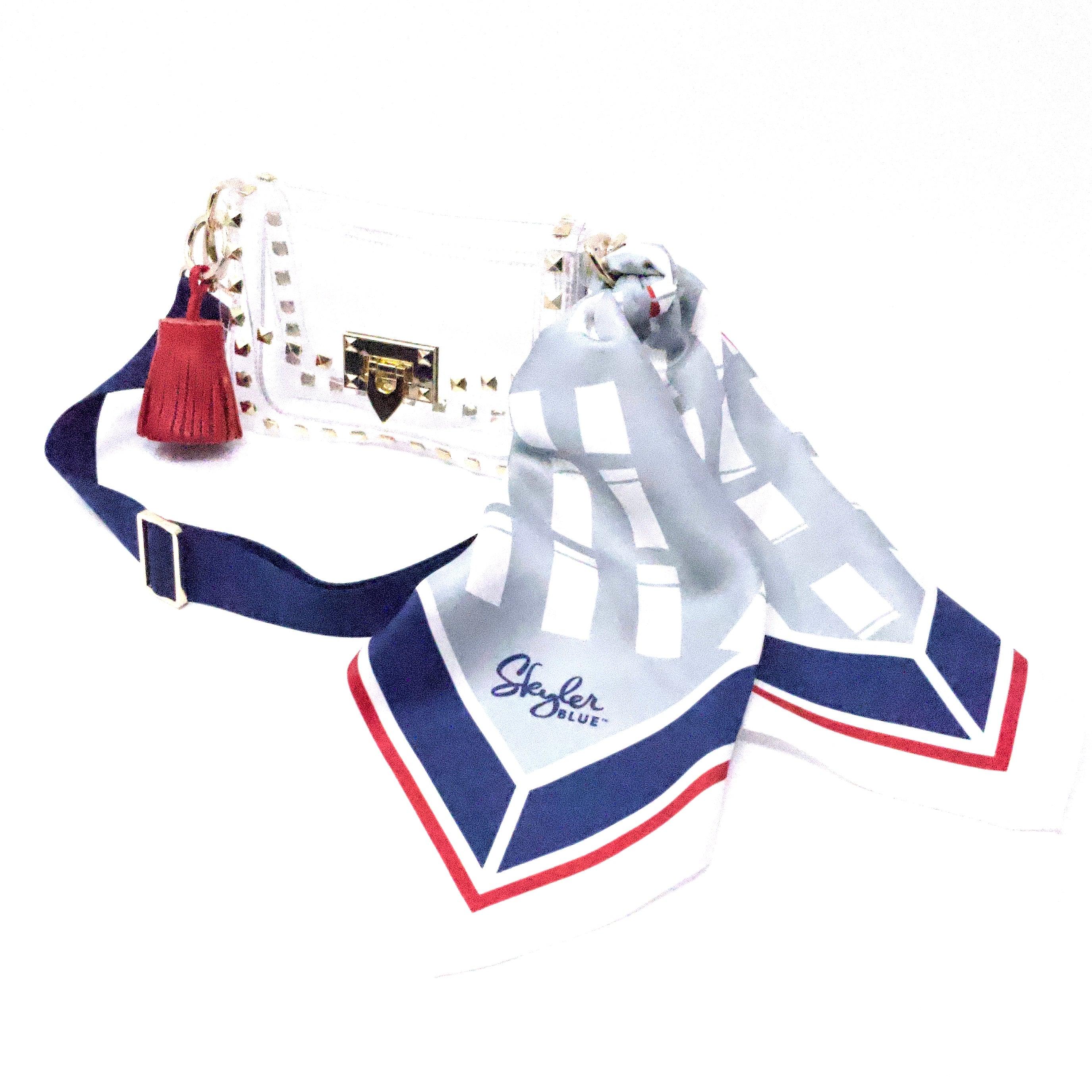 Skyler Blue’s The Dome - Go Texan Day Small Studded Clear Bag stadium approved clear bag / clear purse including adjustable, nylon webbing shoulder or crossbody strap with herringbone weave and gold hardware, 60-centimeter 100% silk twill scarf, and 100% genuine leather tassel.