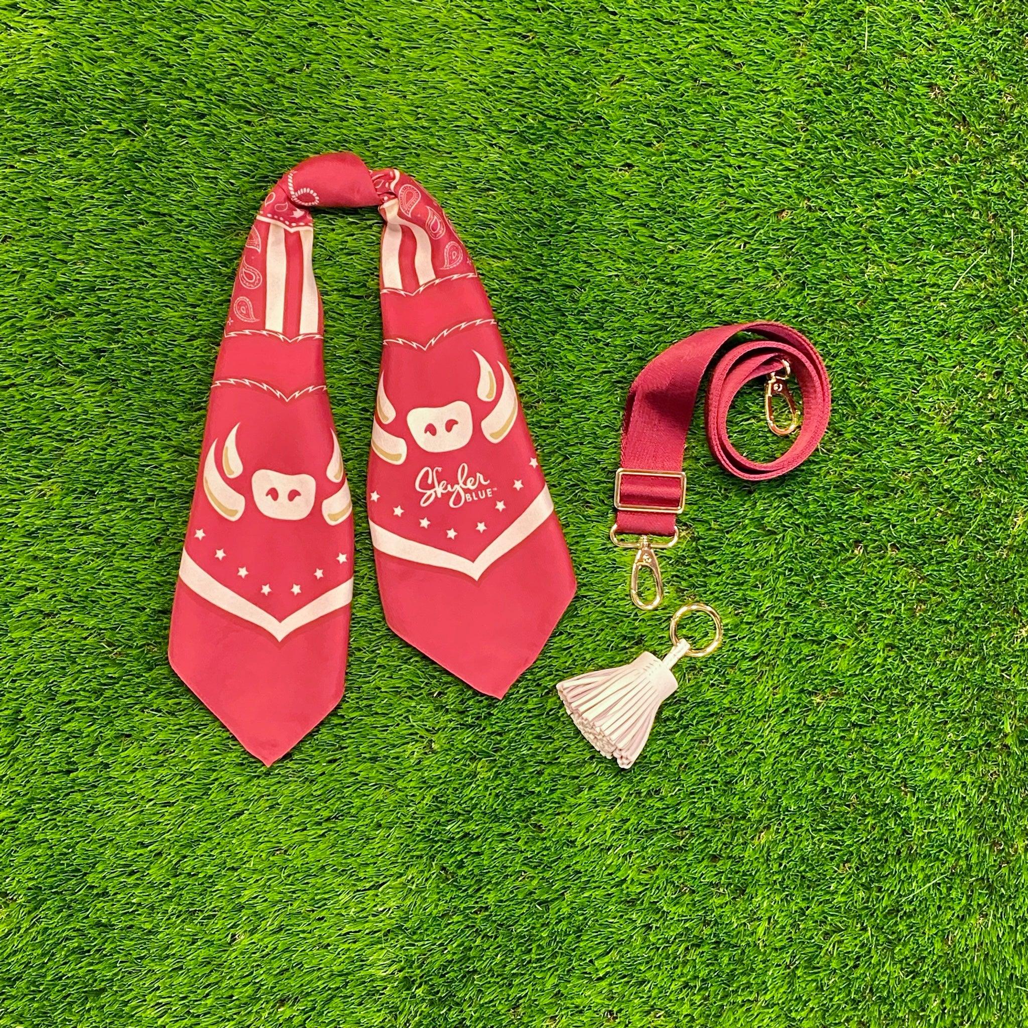 Skyler Blue’s The Fayetteville Accessory Package including adjustable, nylon webbing shoulder or crossbody strap with herringbone weave and gold hardware, 60-centimeter 100% silk twill scarf, and 100% genuine leather tassel.