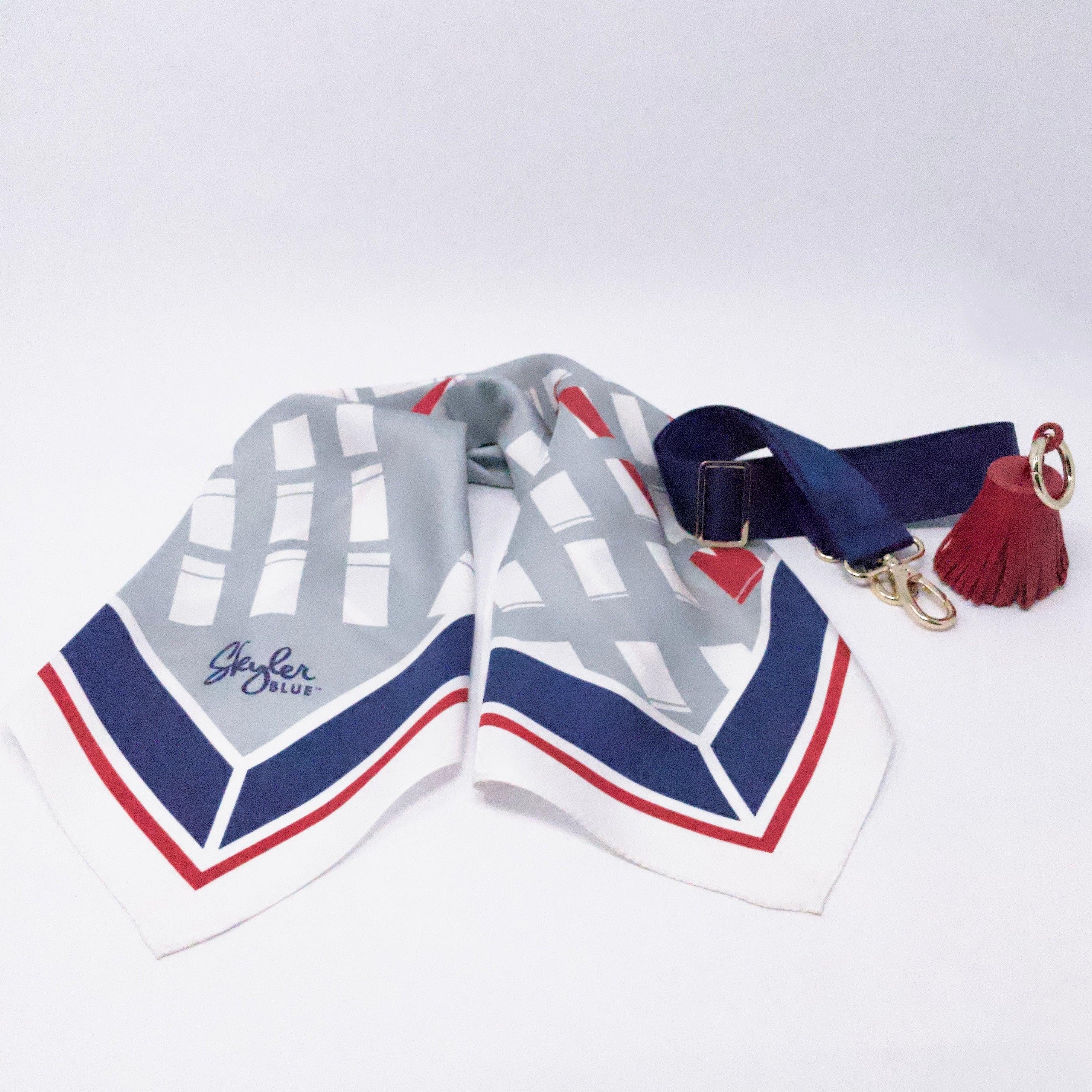 Skyler Blue’s The Dome - Go Texan Day Accessory Package including adjustable, nylon webbing shoulder or crossbody strap with herringbone weave and gold hardware, 60-centimeter 100% silk twill scarf, and 100% genuine leather tassel.