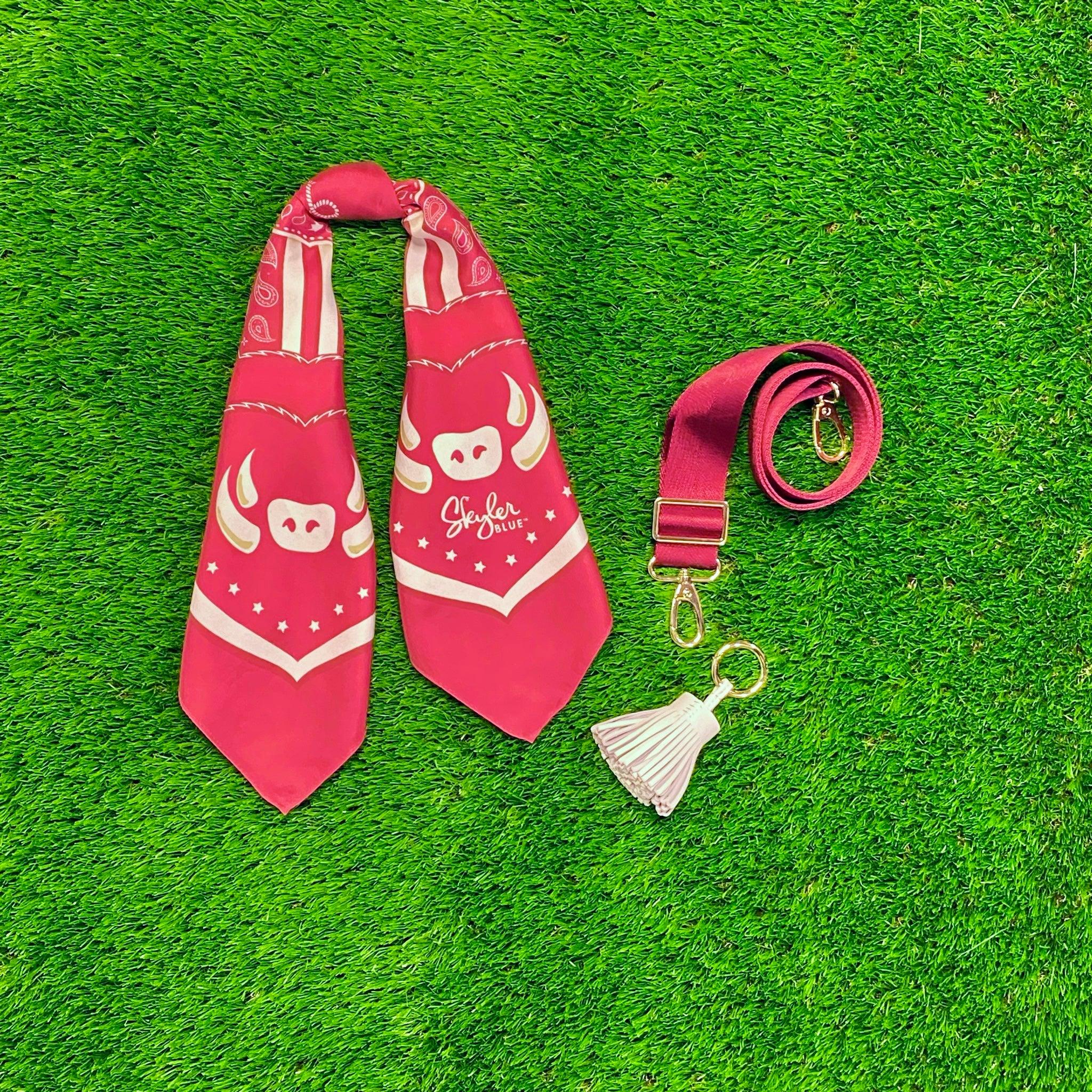 Skyler Blue’s The Fayetteville Accessory Package including adjustable, nylon webbing shoulder or crossbody strap with herringbone weave and gold hardware, 60-centimeter 100% silk twill scarf, and 100% genuine leather tassel.