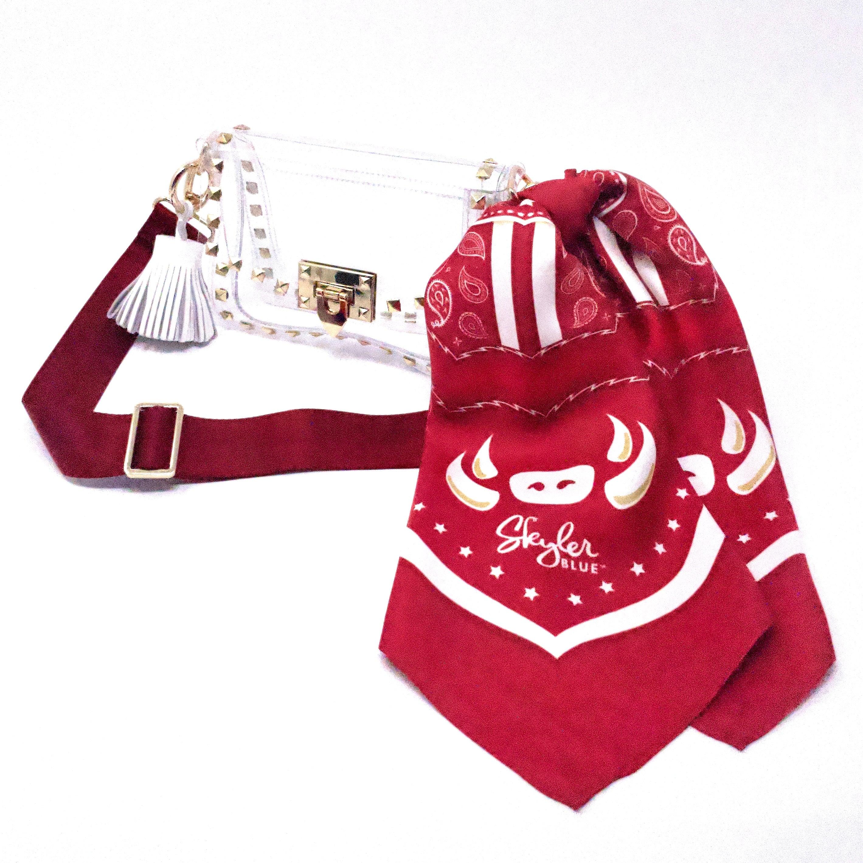 Skyler Blue’s The Fayetteville Small Studded Clear Bag stadium approved clear bag / clear purse including adjustable, nylon webbing shoulder or crossbody strap with herringbone weave and gold hardware, 60-centimeter 100% silk twill scarf, and 100% genuine leather tassel.