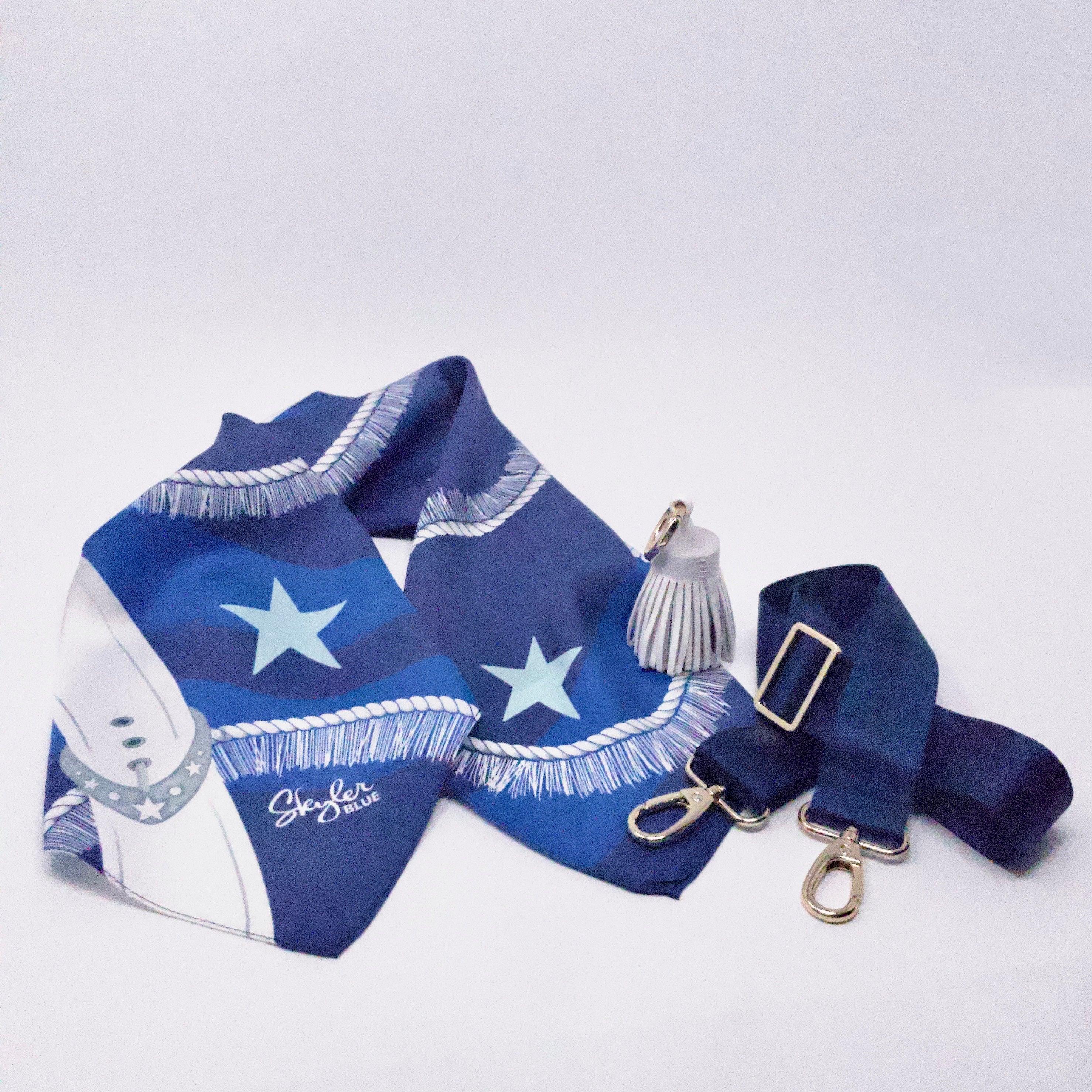 Skyler Blue’s The Dallas 002 Accessory Package including adjustable, nylon webbing shoulder or crossbody strap with herringbone weave and gold hardware, 60-centimeter 100% silk twill scarf, and 100% genuine leather tassel.