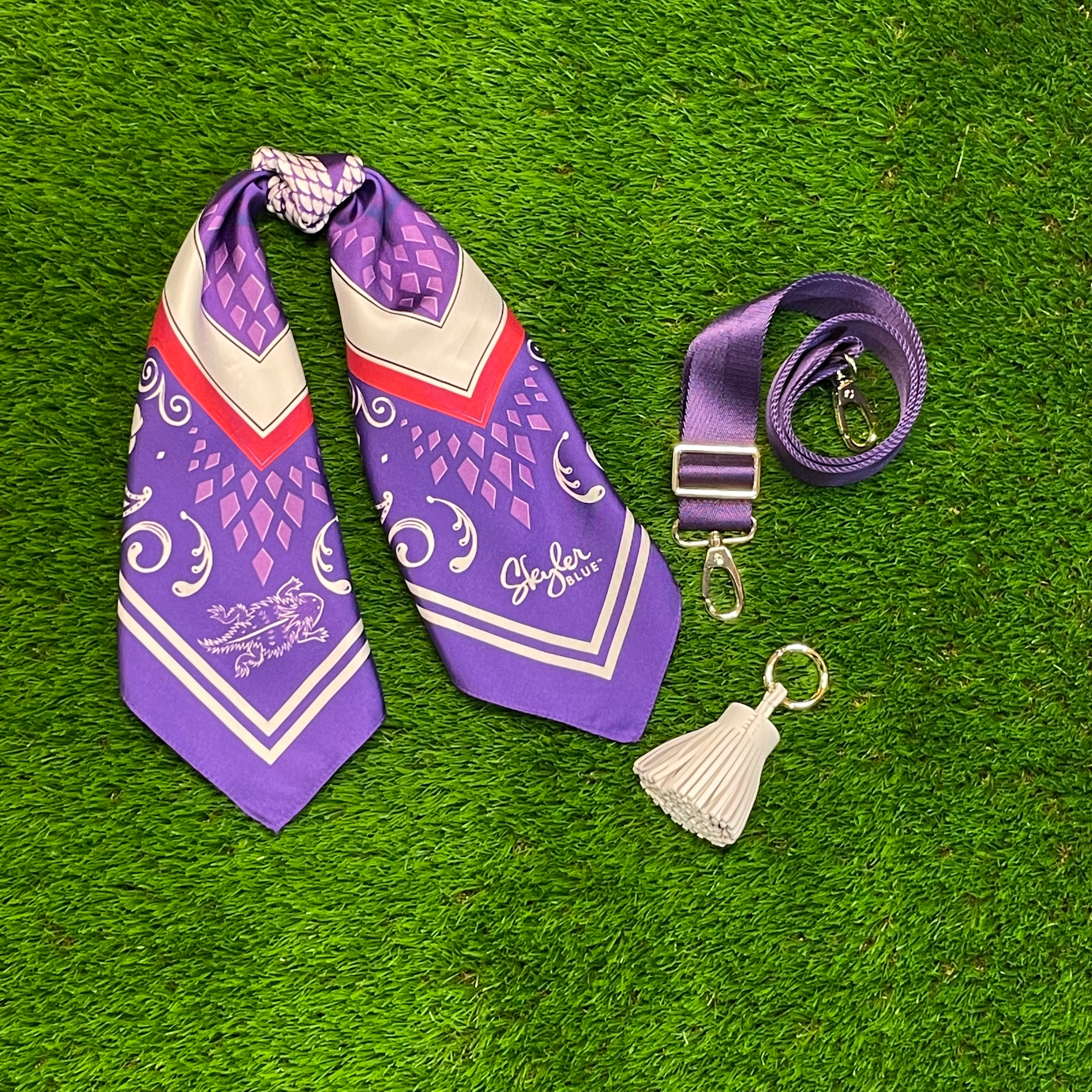 Skyler Blue’s The Fort Worth Accessory Package including adjustable, nylon webbing shoulder or crossbody strap with herringbone weave and gold hardware, 60-centimeter 100% silk twill scarf, and 100% genuine leather tassel.