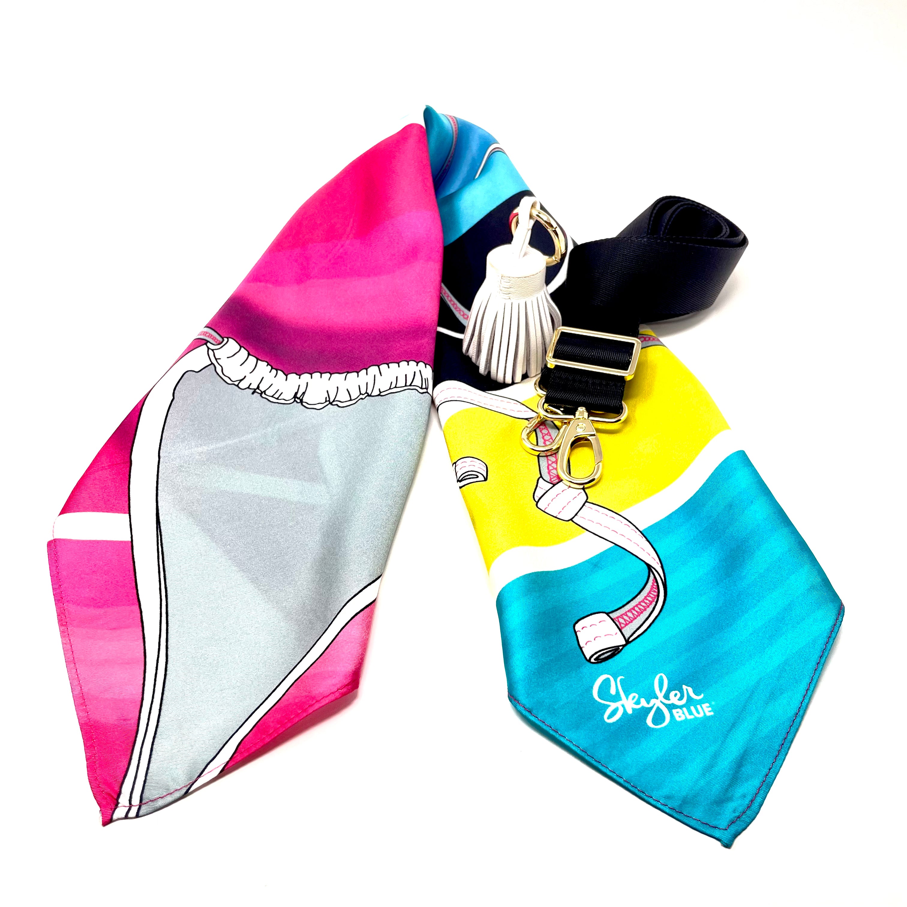 Skyler Blue’s The Bikini Accessory Package including adjustable, nylon webbing shoulder or crossbody strap with herringbone weave and gold hardware, 60-centimeter 100% silk twill scarf, and 100% genuine leather tassel.