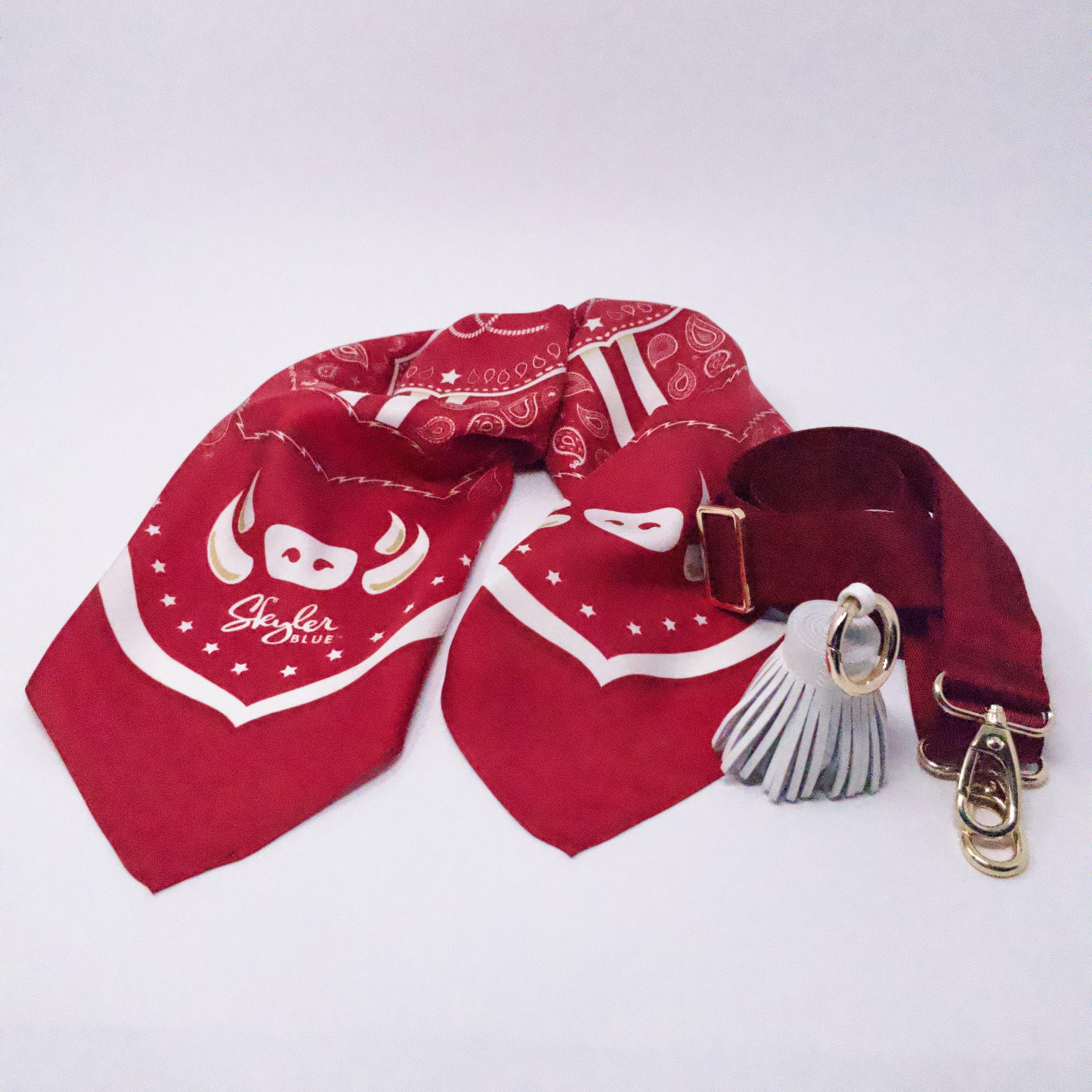 Skyler Blue’s The Fayetteville Accessory Package including adjustable, nylon webbing shoulder or crossbody strap with herringbone weave and gold hardware, 60-centimeter 100% silk twill scarf, and 100% genuine leather tassel.