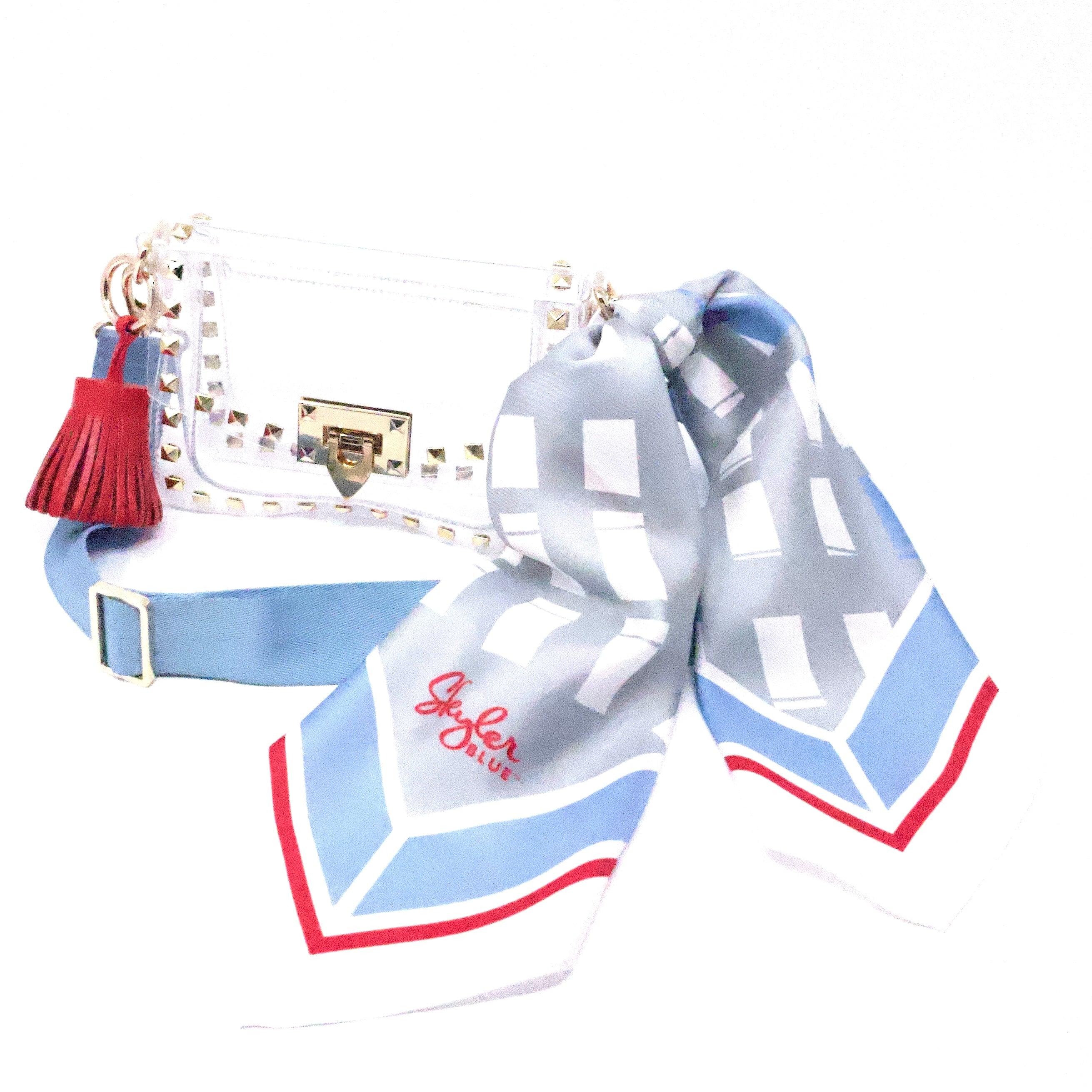 Skyler Blue’s The Dome - Luv Ya Small Studded Clear Bag stadium approved clear bag / clear purse including adjustable, nylon webbing shoulder or crossbody strap with herringbone weave and gold hardware, 60-centimeter 100% silk twill scarf, and 100% genuine leather tassel.