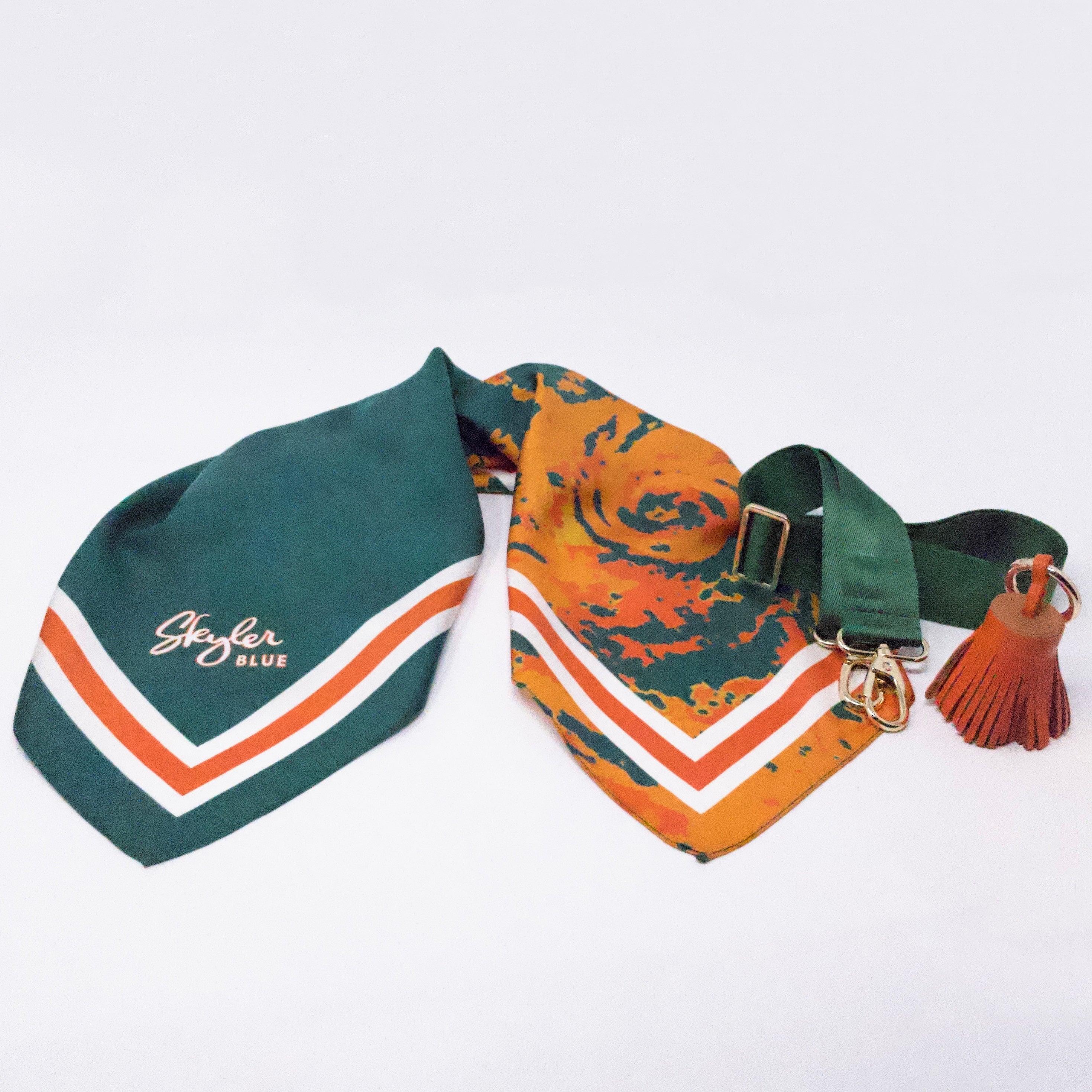 Skyler Blue’s The Coral Gables Accessory Package including adjustable, nylon webbing shoulder or crossbody strap with herringbone weave and gold hardware, 60-centimeter 100% silk twill scarf, and 100% genuine leather tassel.