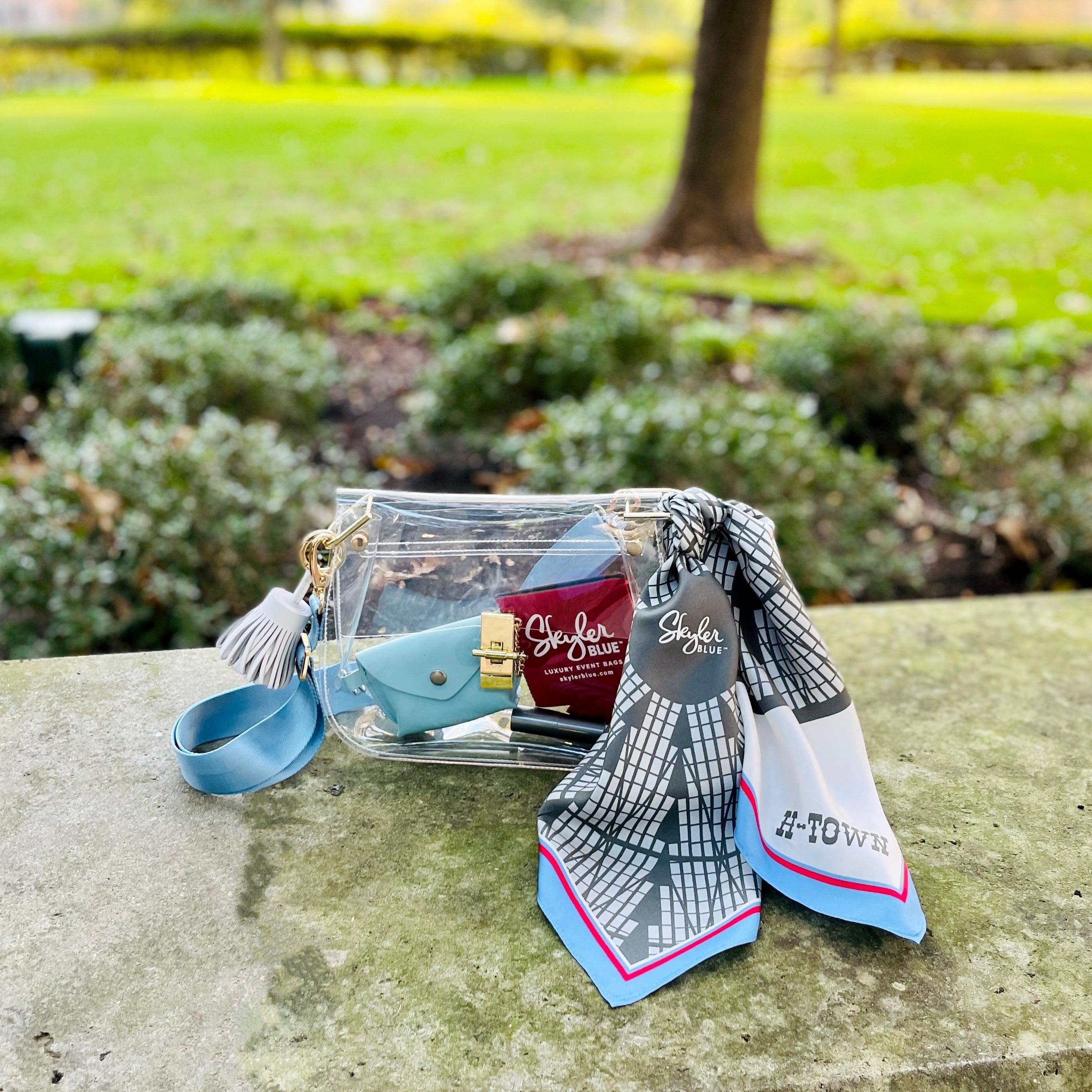 Skyler Blue’s The Dome - H-Town Medium Saddle Clear Bag stadium approved clear bag / clear purse including adjustable, nylon webbing shoulder or crossbody strap with herringbone weave and gold hardware, 60-centimeter 100% silk twill scarf, and 100% genuine leather tassel.