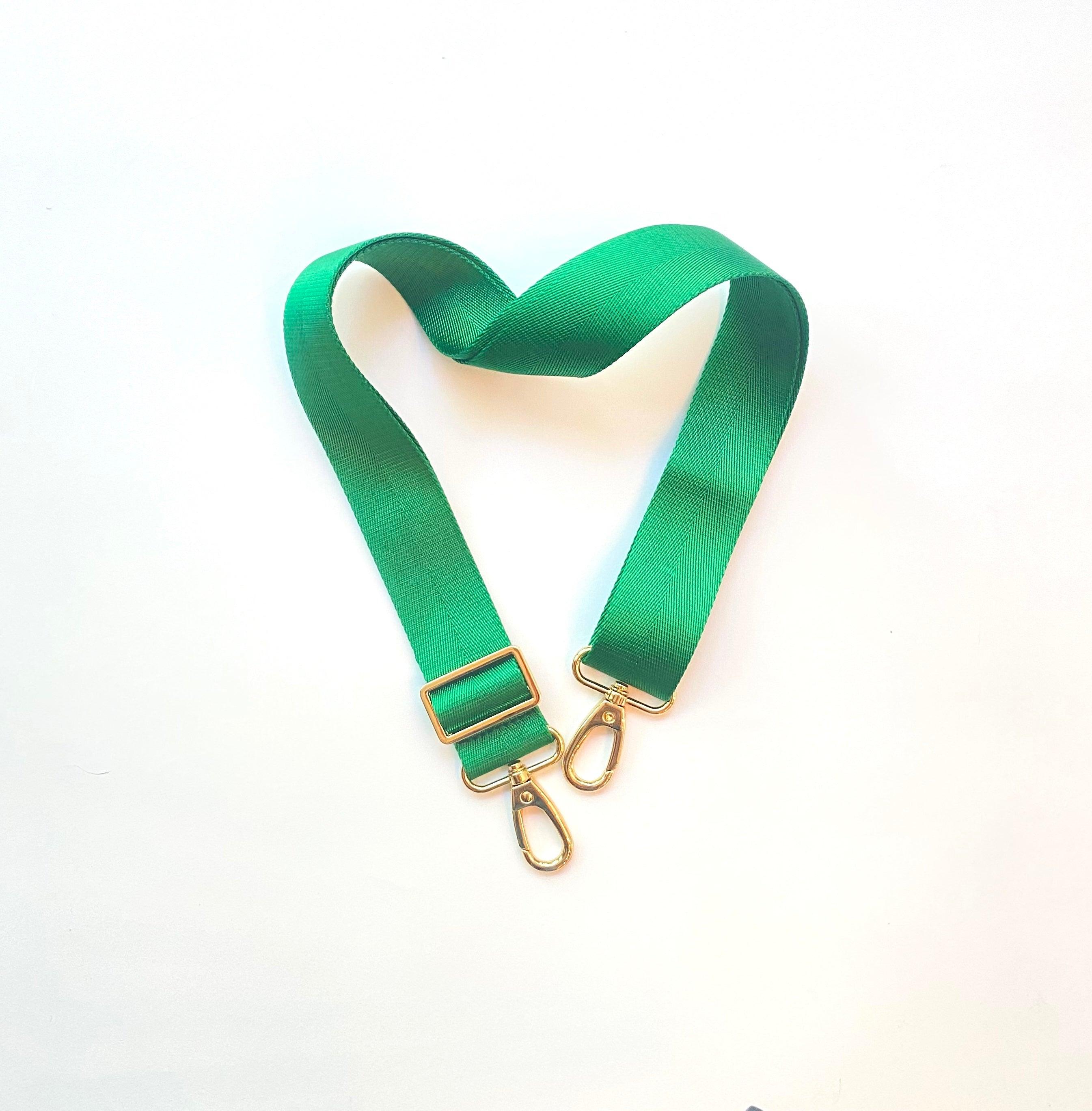 Skyler Blue’s adjustable, nylon webbing kelly green shoulder or crossbody strap with herringbone weave and gold hardware.