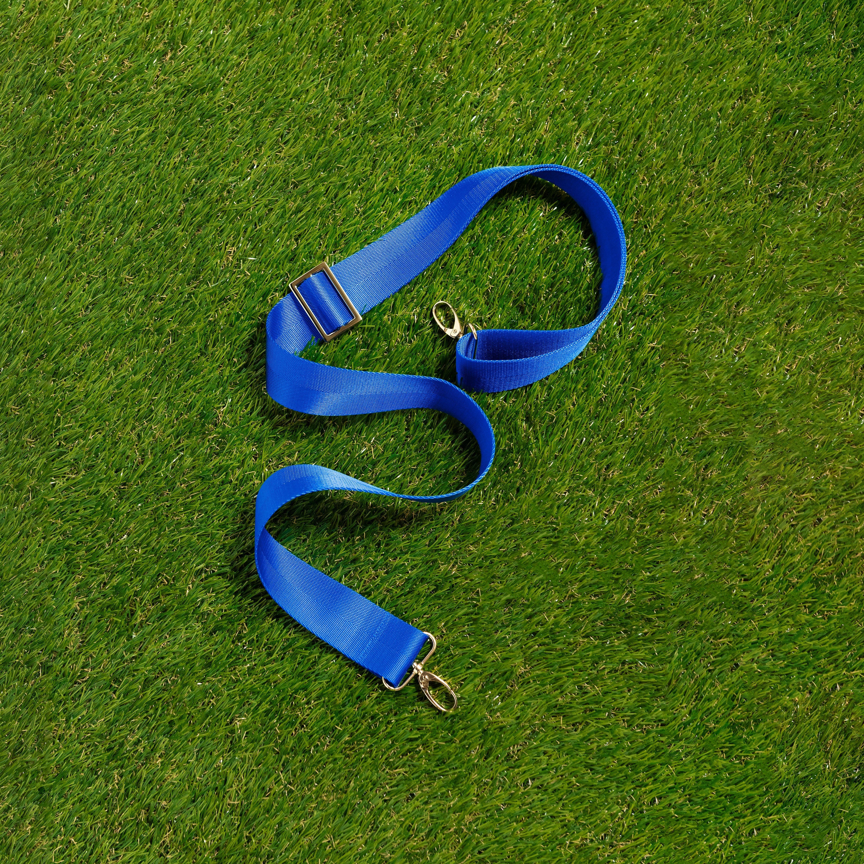 Skyler Blue’s adjustable, nylon webbing royal blue fanny pack strap with herringbone weave and gold hardware.  