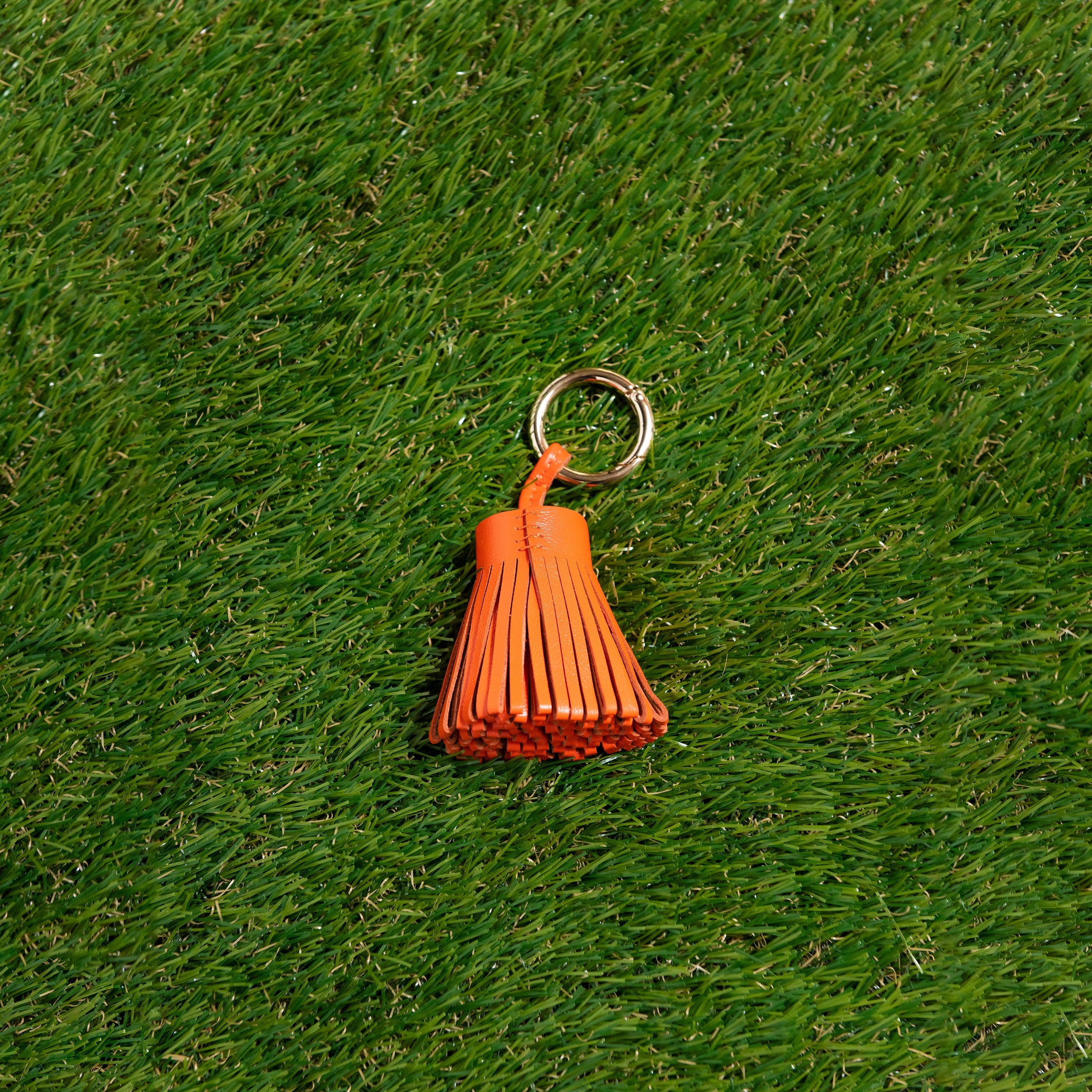 Skyler Blue’s orange 100% genuine leather tassel. 