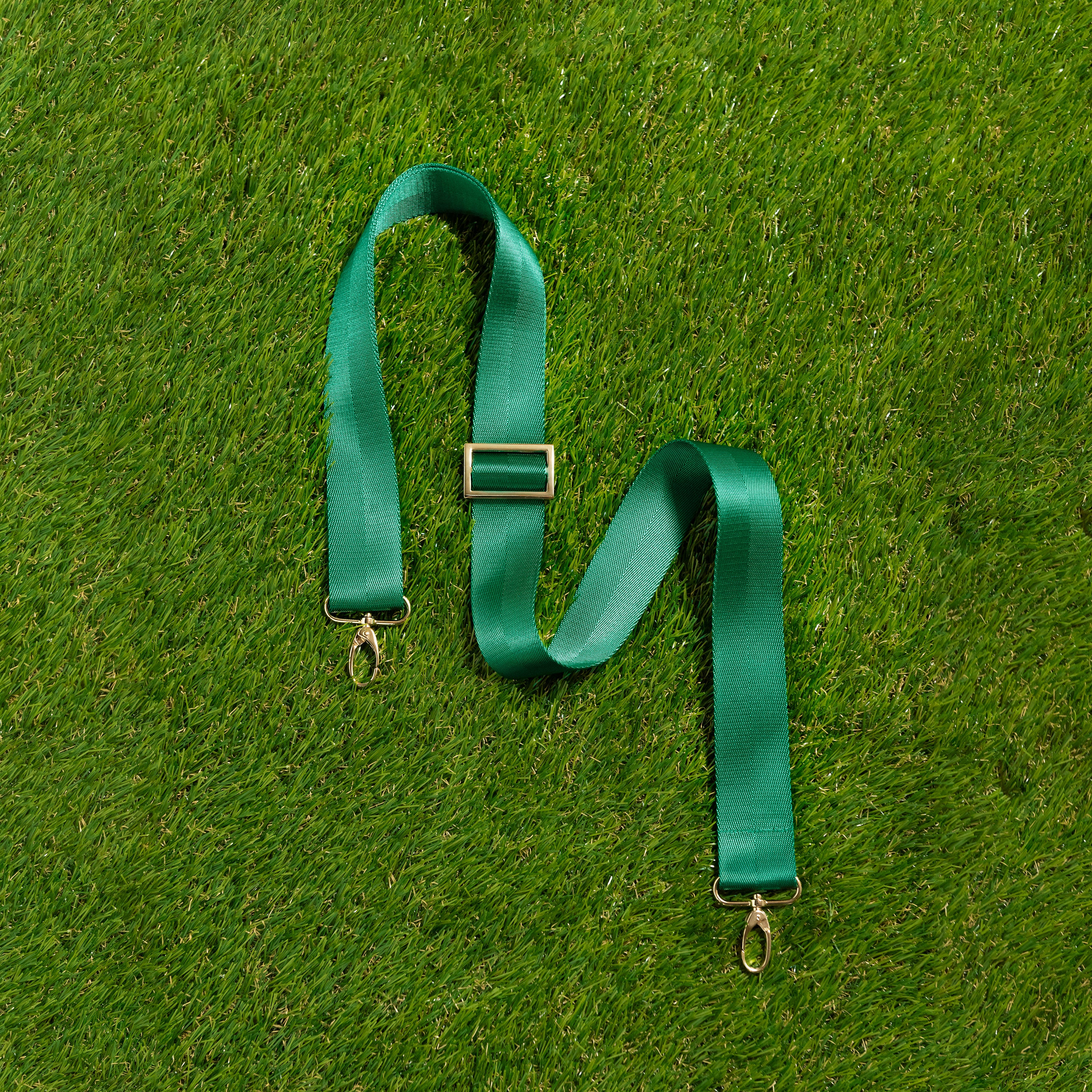 Skyler Blue’s adjustable, nylon webbing green shoulder or crossbody strap with herringbone weave and gold hardware.  