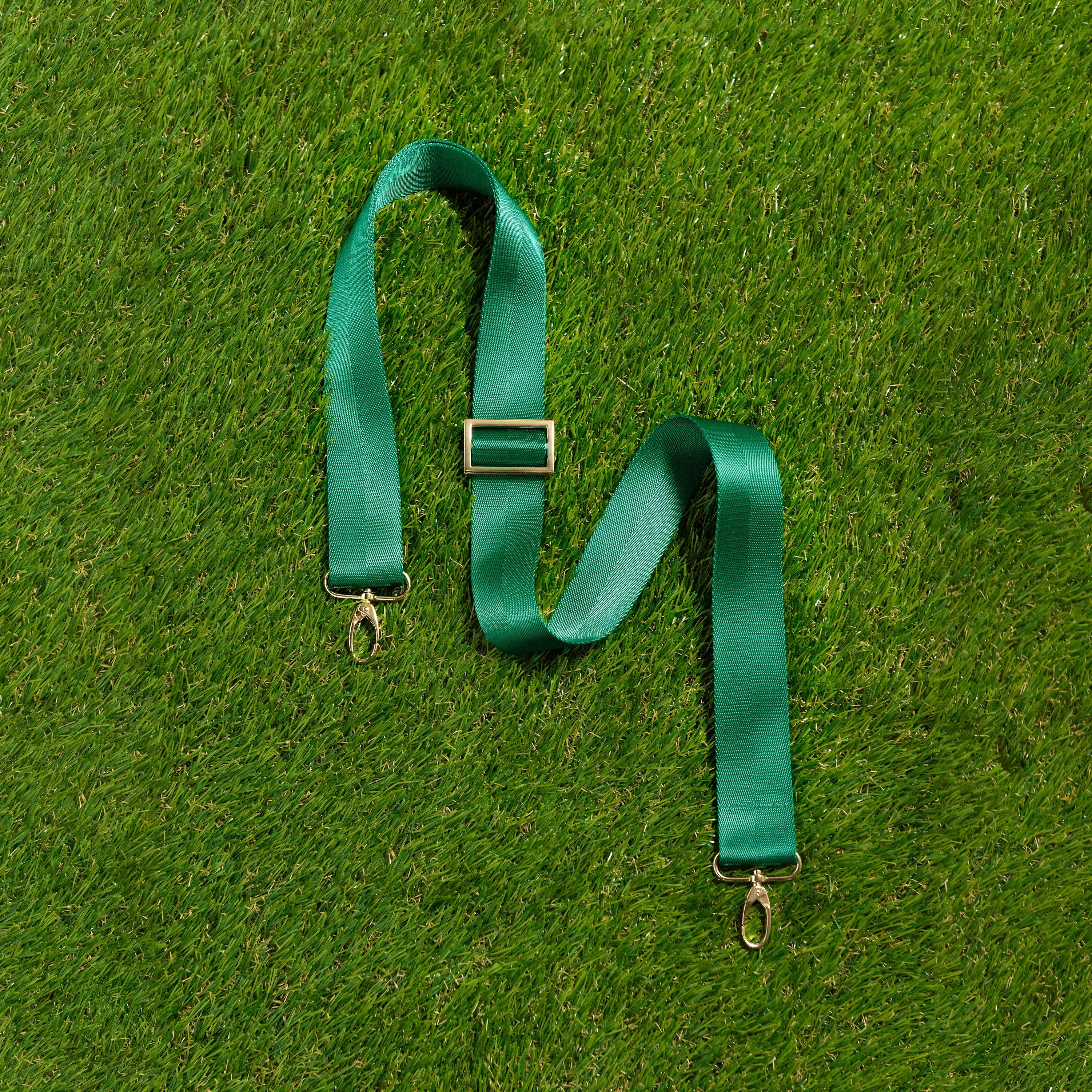 Skyler Blue’s adjustable, nylon webbing dark green fanny pack strap with herringbone weave and gold hardware.  