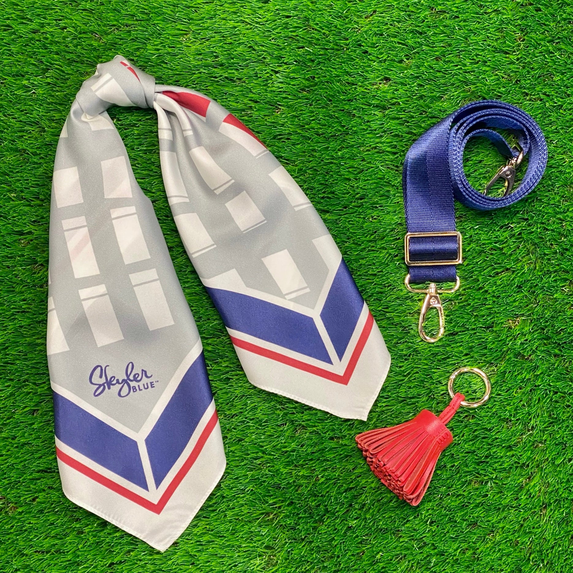 Skyler Blue’s The Dome - Go Texan Day Accessory Package including adjustable, nylon webbing shoulder or crossbody strap with herringbone weave and gold hardware, 60-centimeter 100% silk twill scarf, and 100% genuine leather tassel. 