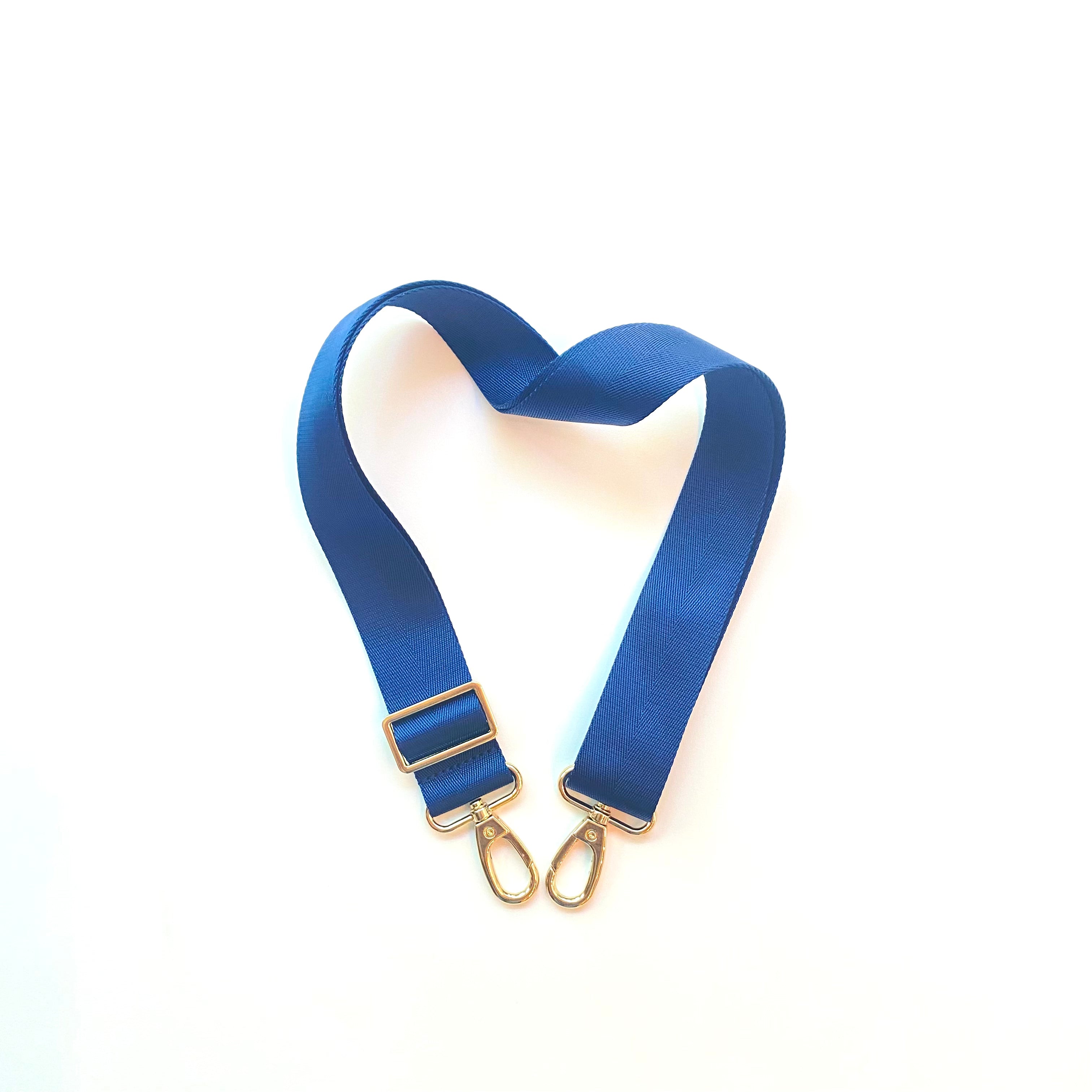 Skyler Blue’s adjustable, nylon webbing navy blue shoulder or crossbody strap with herringbone weave and gold hardware.  