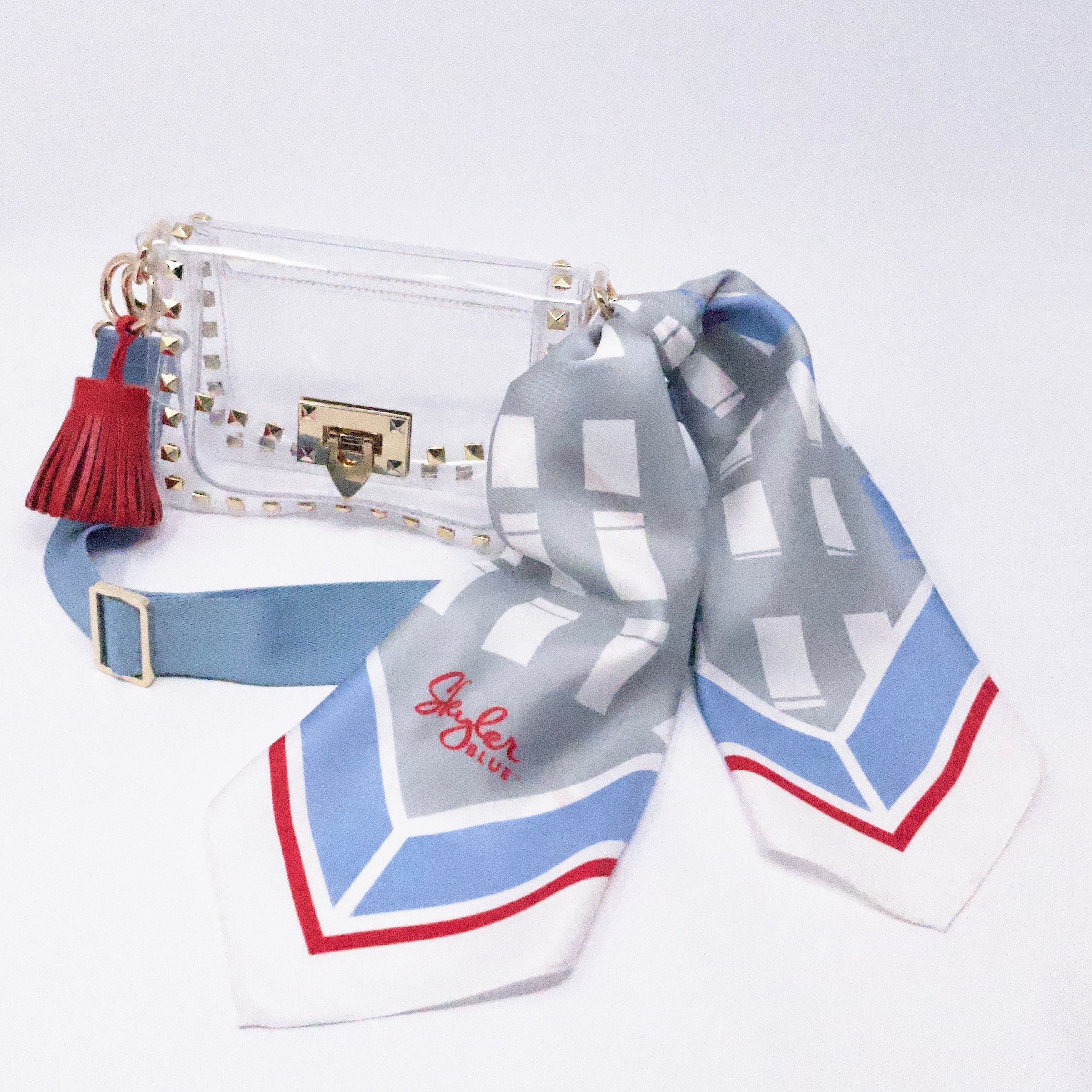 Skyler Blue’s The Dome - Luv Ya Small Studded Clear Bag stadium approved clear bag / clear purse including adjustable, nylon webbing shoulder or crossbody strap with herringbone weave and gold hardware, 60-centimeter 100% silk twill scarf, and 100% genuine leather tassel. 