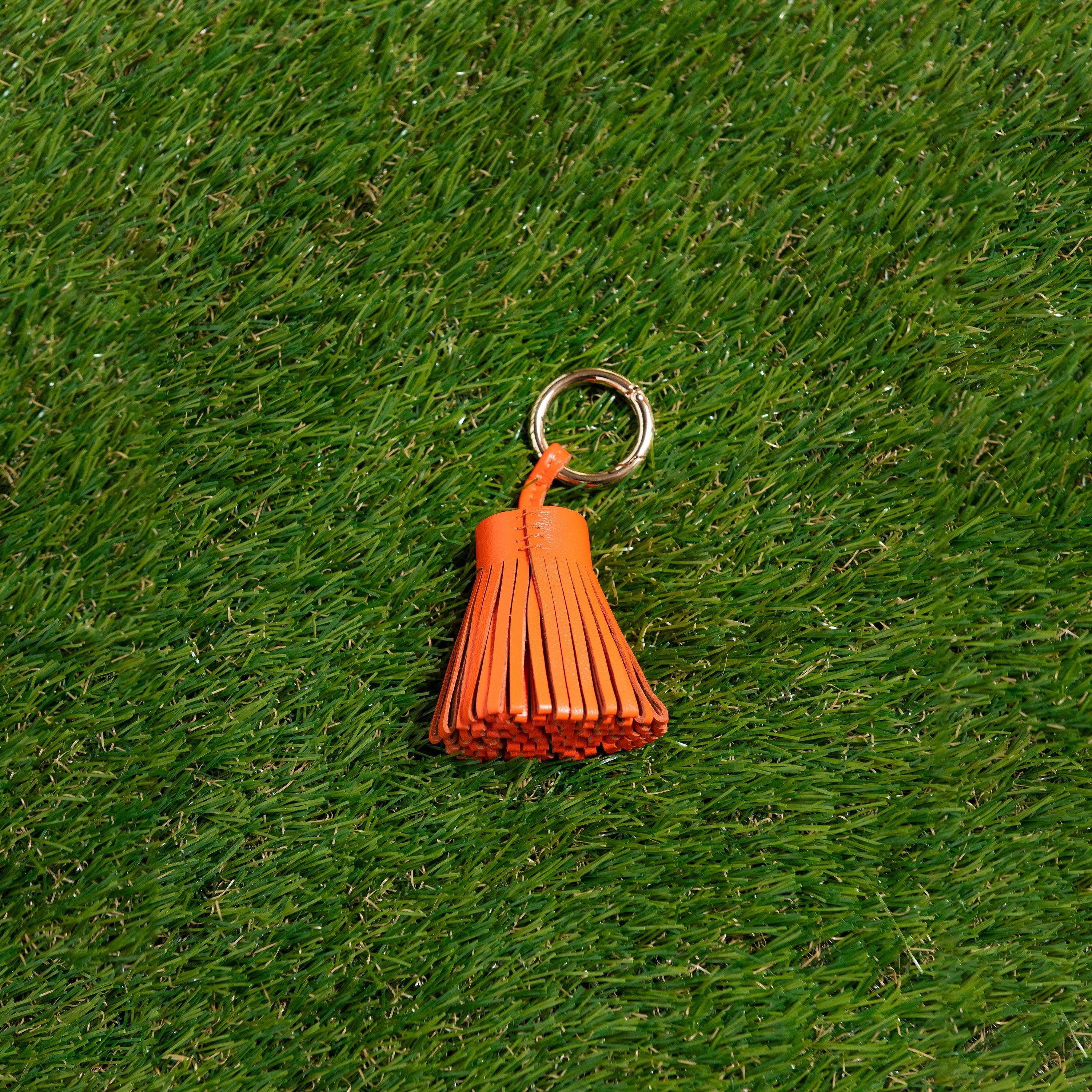 Skyler Blue’s orange 100% genuine leather tassel. 