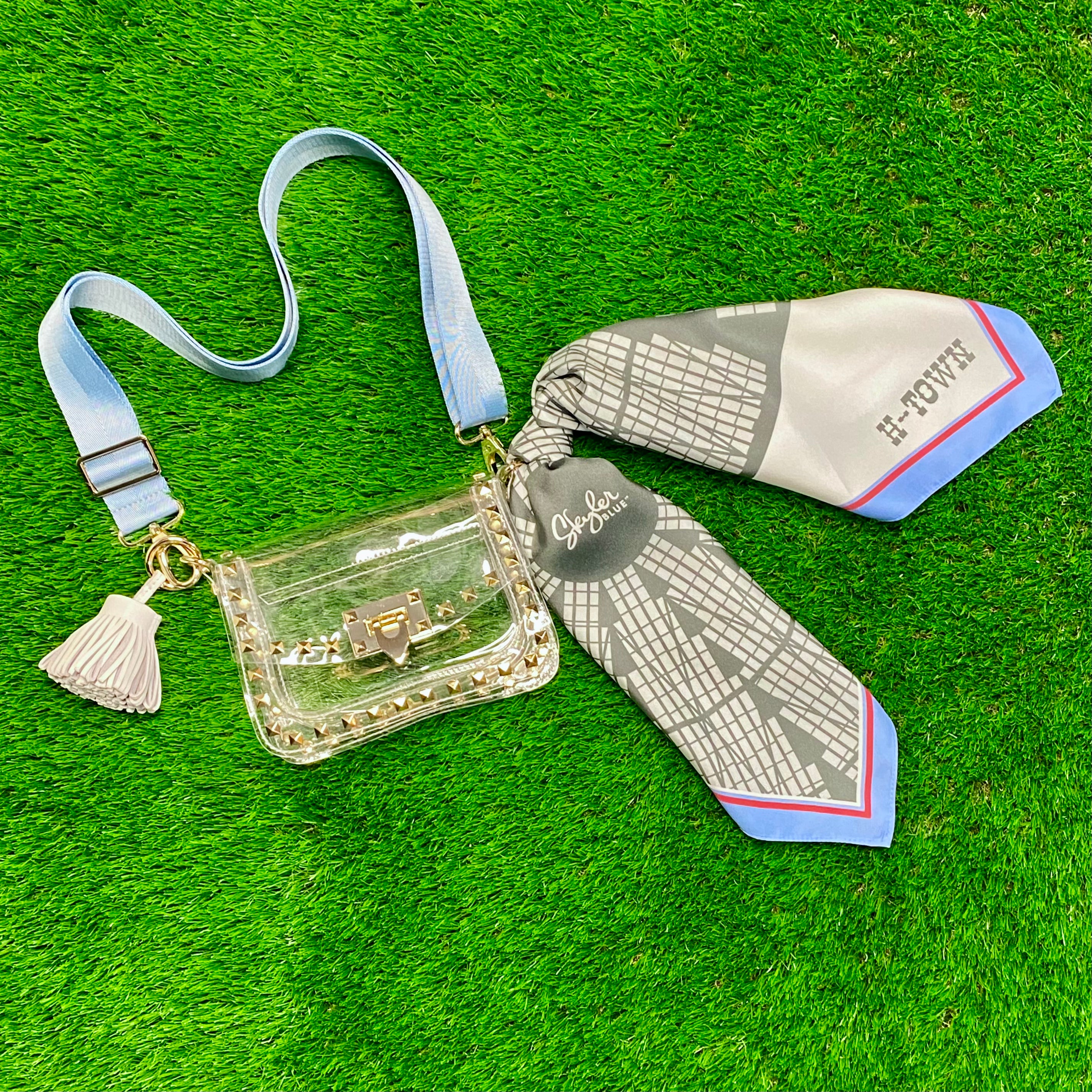 Skyler Blue’s The Dome - H-Town Small Studded Clear Bag stadium approved clear bag / clear purse including adjustable, nylon webbing shoulder or crossbody strap with herringbone weave and gold hardware, 60-centimeter 100% silk twill scarf, and 100% genuine leather tassel. 