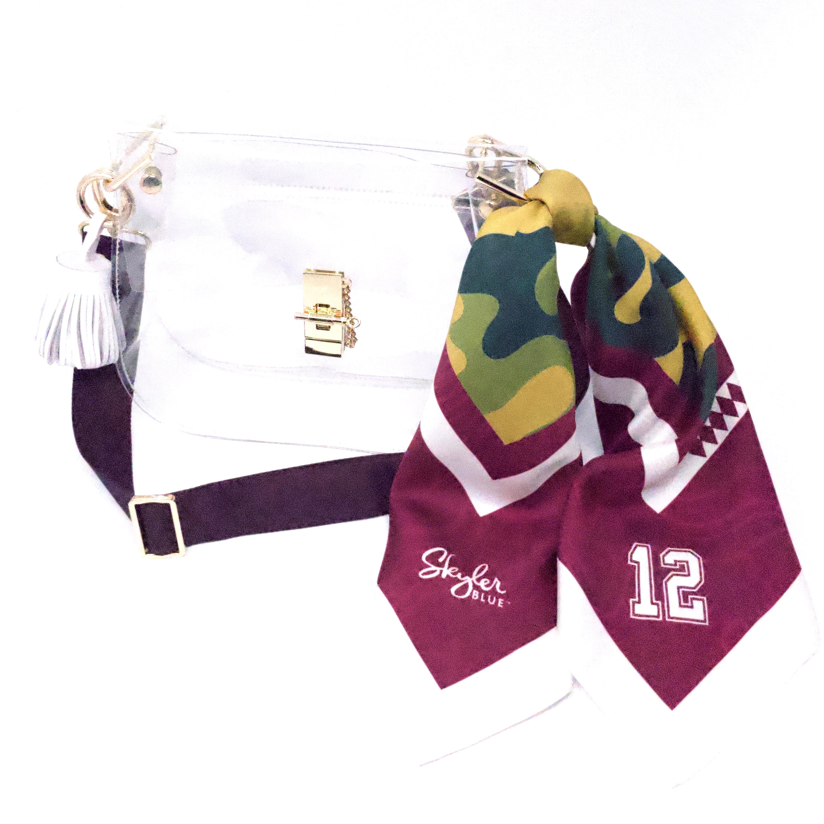 Skyler Blue’s The College Station Medium Saddle Clear Bag stadium approved clear bag / clear purse including adjustable, nylon webbing shoulder or crossbody strap with herringbone weave and gold hardware, 60-centimeter 100% silk twill scarf, and 100% genuine leather tassel. 
